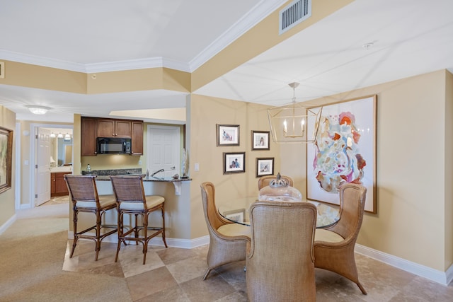 dining area featuring ornamental molding and a notable chandelier