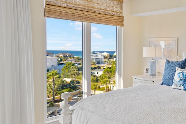 bedroom featuring a water view