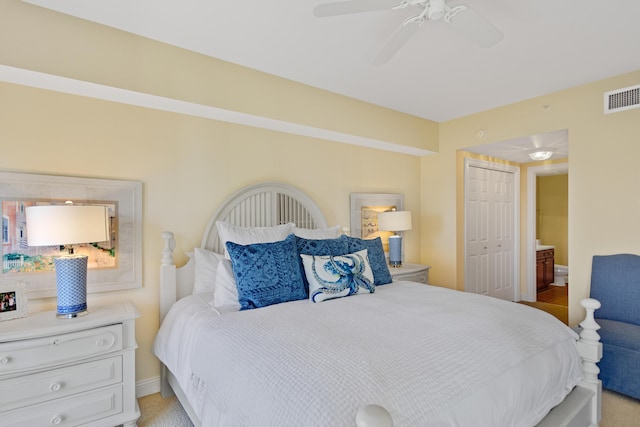 carpeted bedroom featuring ceiling fan and a closet