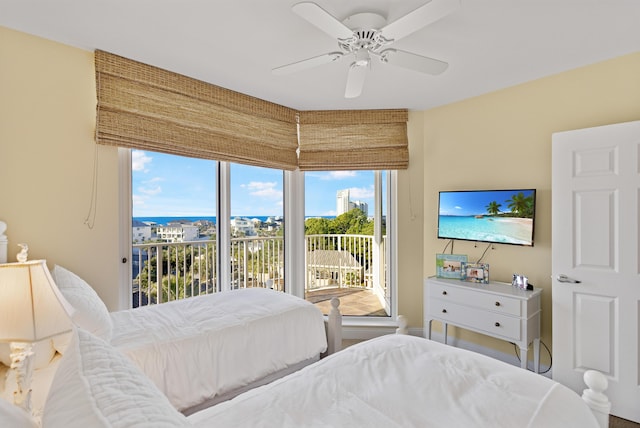 bedroom with ceiling fan, access to outside, and multiple windows