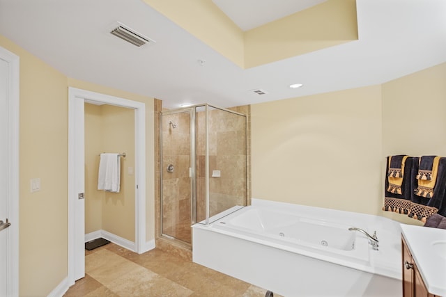 bathroom with separate shower and tub and vanity