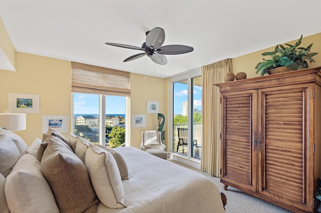 carpeted bedroom featuring access to outside and ceiling fan