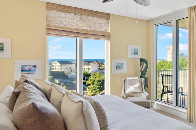 bedroom featuring carpet flooring, ceiling fan, and access to exterior