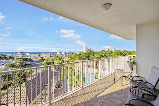 balcony featuring a water view