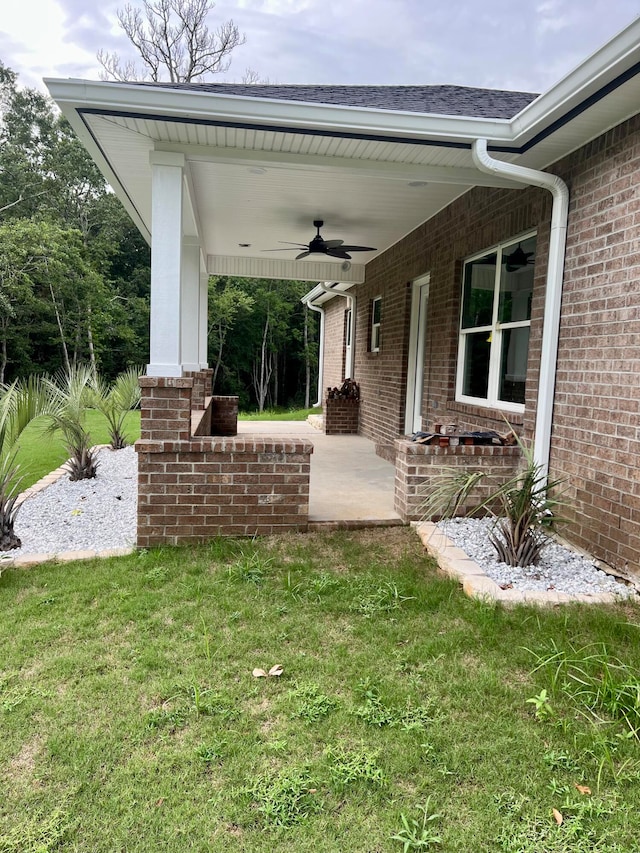 exterior space featuring ceiling fan