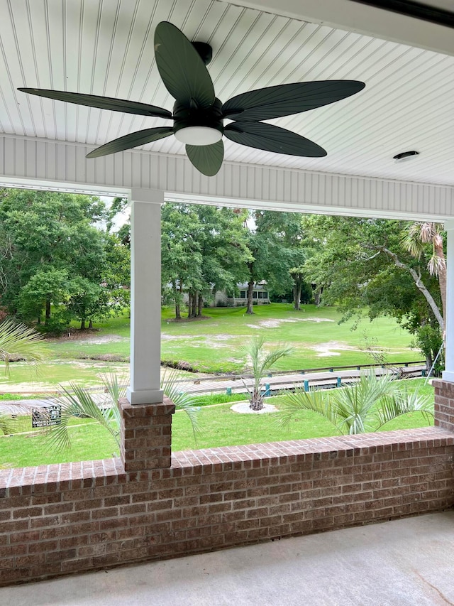 exterior space featuring ceiling fan