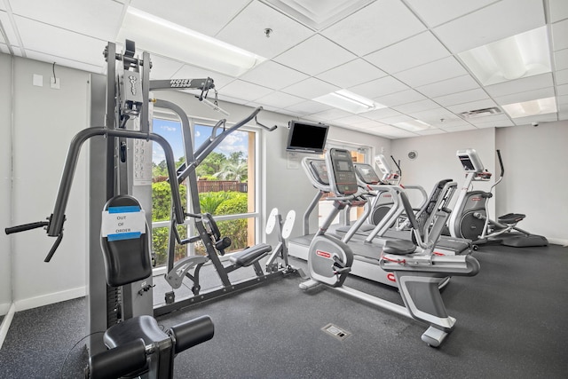 exercise room featuring a paneled ceiling