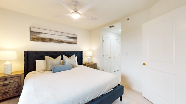 bedroom with ceiling fan and a closet