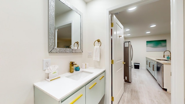 interior space with vanity and hardwood / wood-style floors