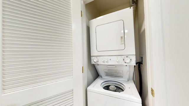 laundry area with stacked washer / dryer