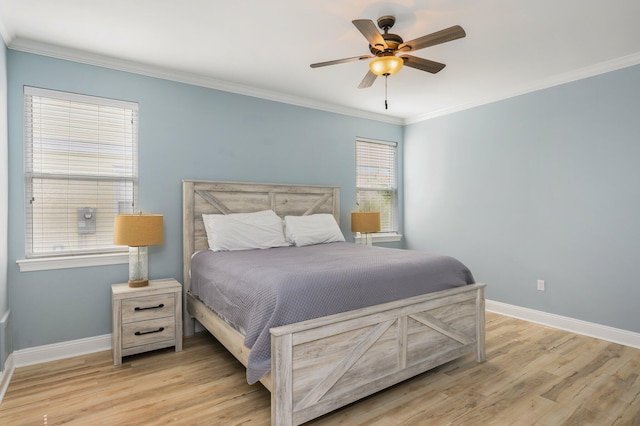 bedroom with ornamental molding, light hardwood / wood-style floors, and ceiling fan