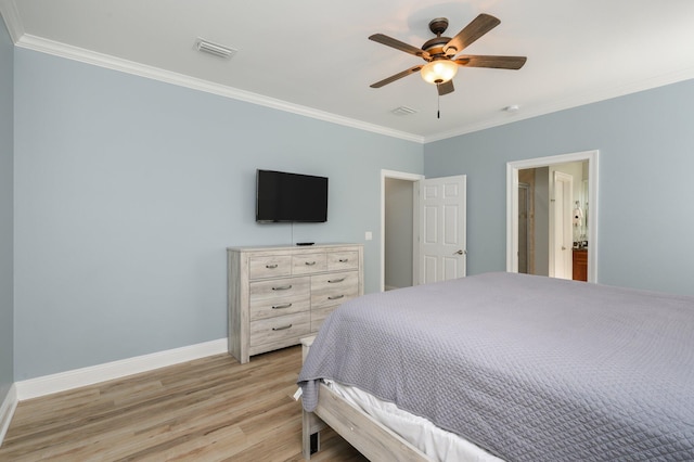 bedroom featuring light hardwood / wood-style flooring, ceiling fan, and crown molding