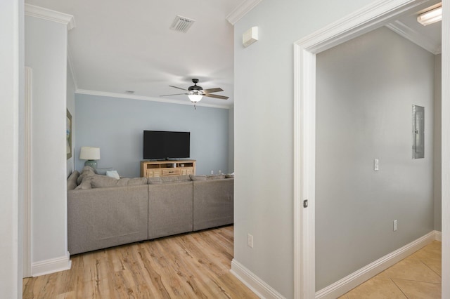 living room with crown molding, ceiling fan, and light wood-type flooring