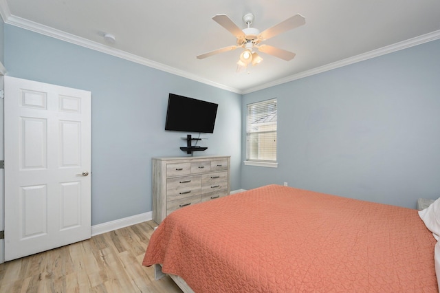 bedroom featuring ornamental molding, light hardwood / wood-style flooring, and ceiling fan