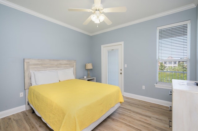 bedroom with light hardwood / wood-style flooring, ceiling fan, and ornamental molding