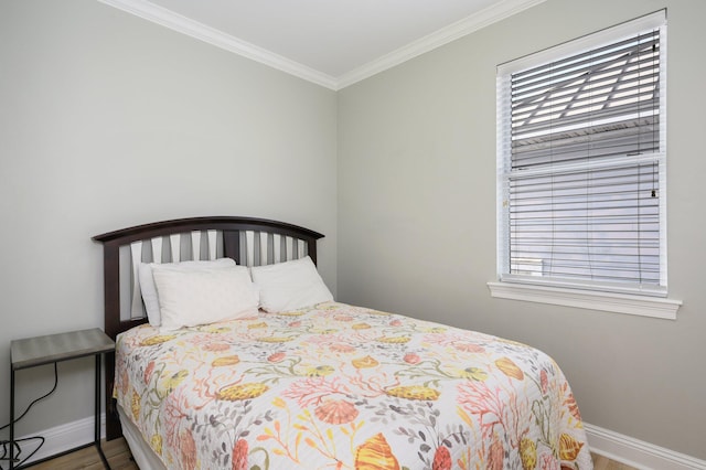 bedroom with crown molding and wood-type flooring