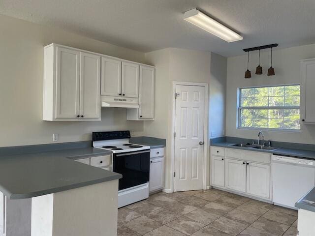 kitchen featuring white cabinets, sink, and white appliances