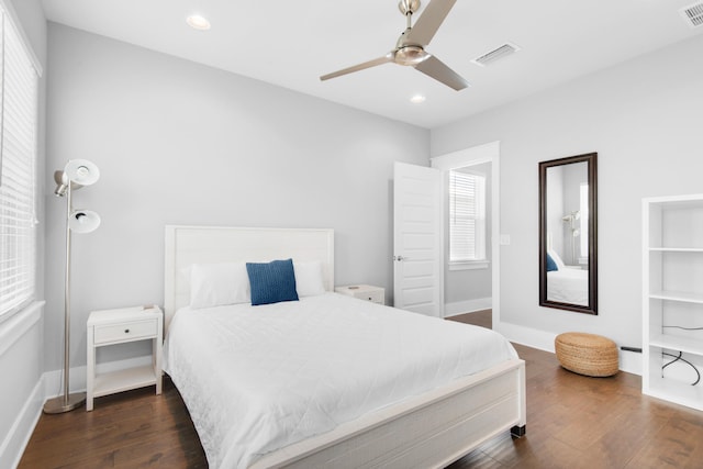 bedroom featuring dark hardwood / wood-style flooring and ceiling fan