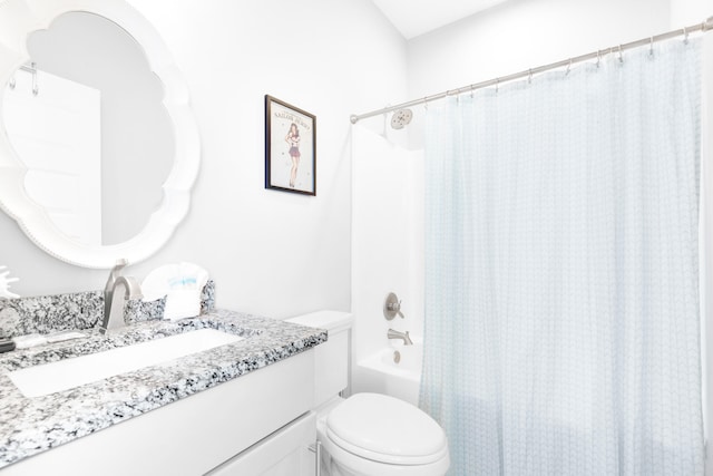 full bathroom with vanity, shower / bathtub combination with curtain, and toilet