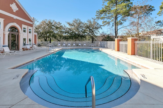 view of swimming pool with a patio