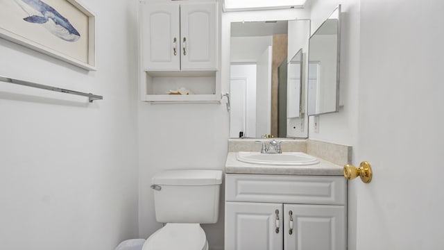 bathroom with oversized vanity and toilet