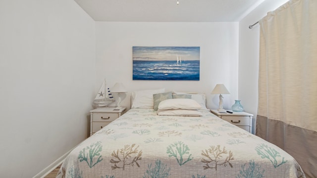 bedroom featuring wood-type flooring