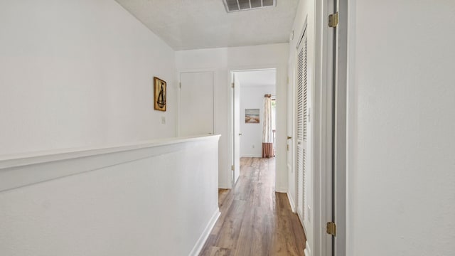 hall featuring wood-type flooring