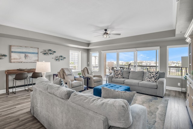 living room featuring light hardwood / wood-style flooring, ceiling fan, and plenty of natural light