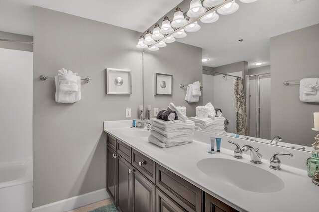 bathroom with dual vanity