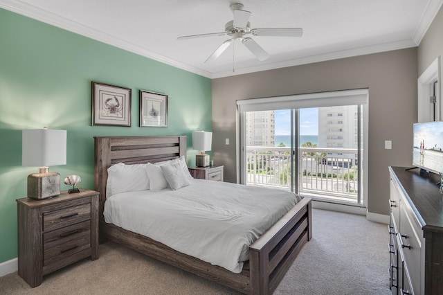 carpeted bedroom featuring crown molding and ceiling fan