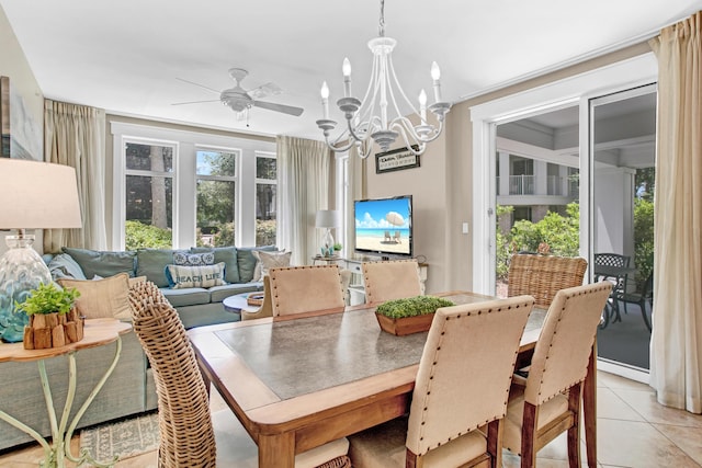 dining room with ceiling fan with notable chandelier and light tile patterned flooring