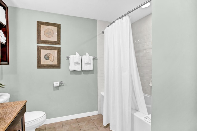 full bathroom featuring tile patterned flooring, vanity, toilet, and shower / bath combo with shower curtain