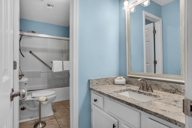 full bathroom with tile flooring, combined bath / shower with glass door, vanity, and toilet