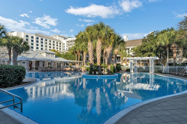 view of swimming pool with a pergola