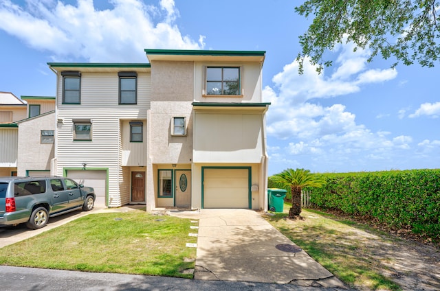 view of front of house featuring a front yard and a garage