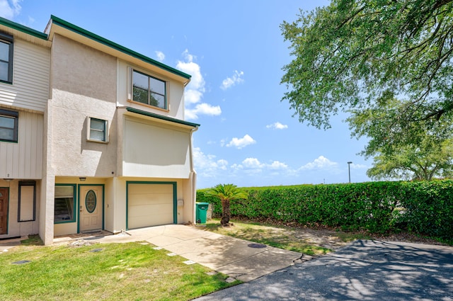 view of front of property with a garage