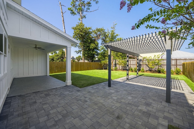 view of terrace featuring ceiling fan and a pergola