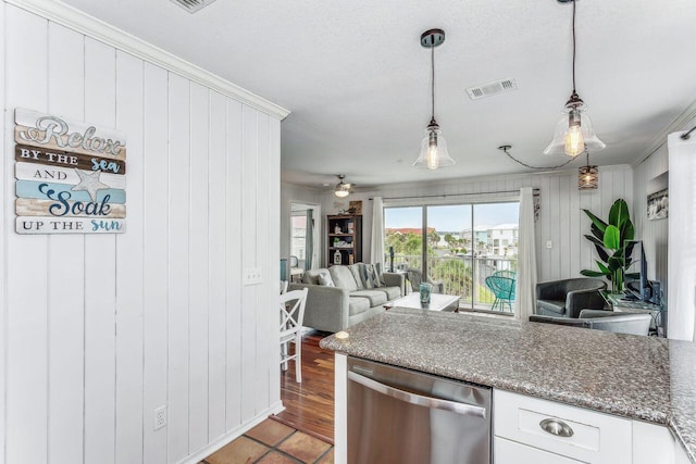 kitchen featuring decorative light fixtures, white cabinets, stainless steel dishwasher, dark stone countertops, and ceiling fan