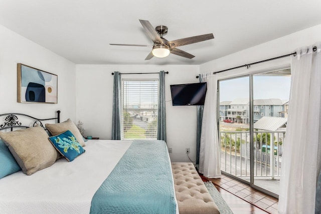 bedroom with light hardwood / wood-style flooring, ceiling fan, and access to exterior