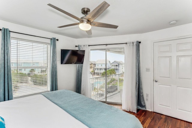 bedroom featuring ceiling fan, dark wood-type flooring, and access to exterior