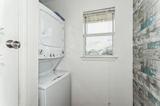 washroom featuring stacked washer and dryer