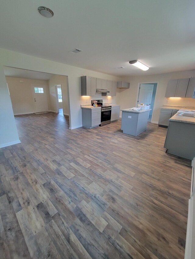 unfurnished living room featuring hardwood / wood-style floors