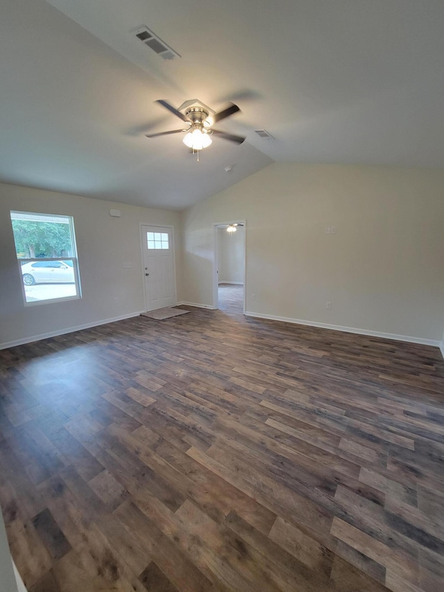 empty room featuring ceiling fan, dark wood-type flooring, and lofted ceiling