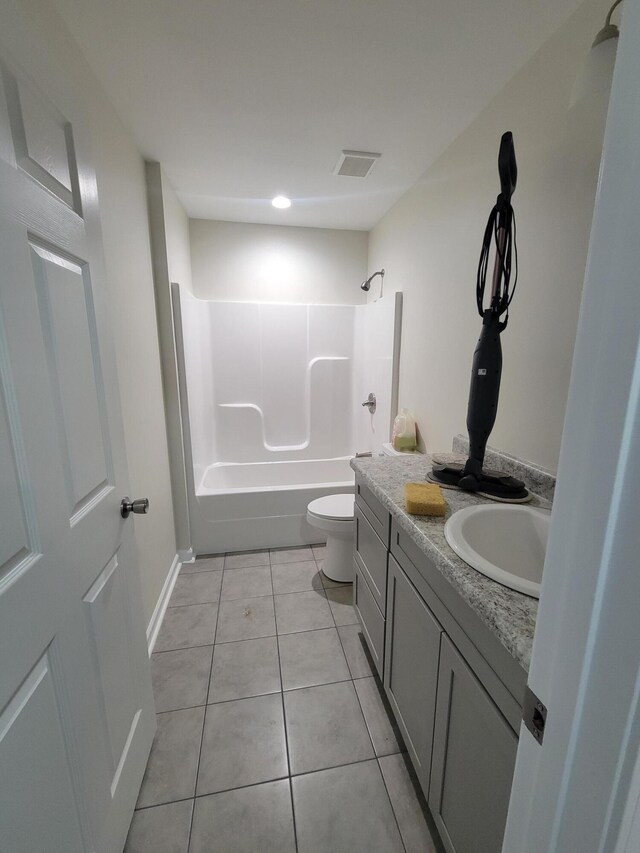 full bathroom featuring vanity, toilet, shower / washtub combination, and tile patterned flooring