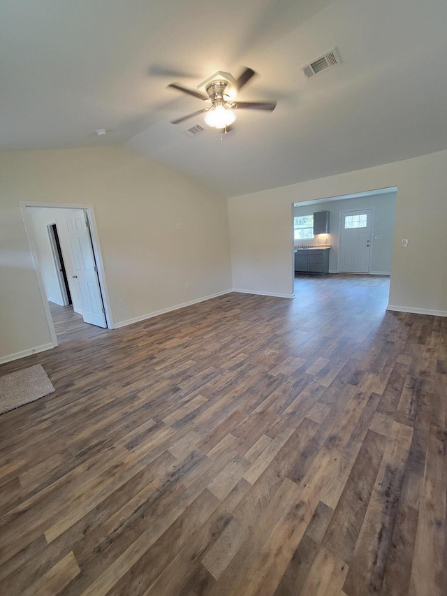 unfurnished living room with ceiling fan, dark hardwood / wood-style floors, and lofted ceiling