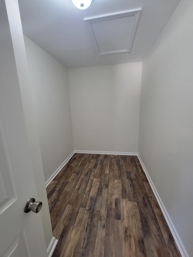 spare room with wood-type flooring