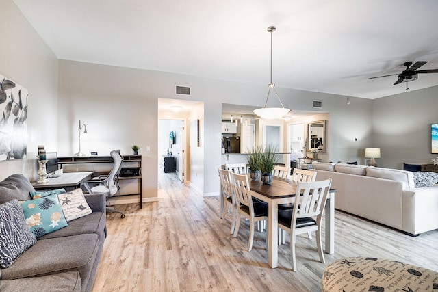 dining area featuring light hardwood / wood-style flooring and ceiling fan