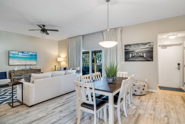 dining area featuring light hardwood / wood-style floors and ceiling fan