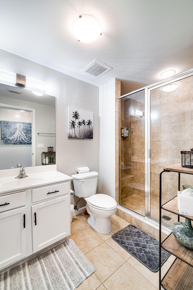 bathroom with an enclosed shower, toilet, tile flooring, and vanity