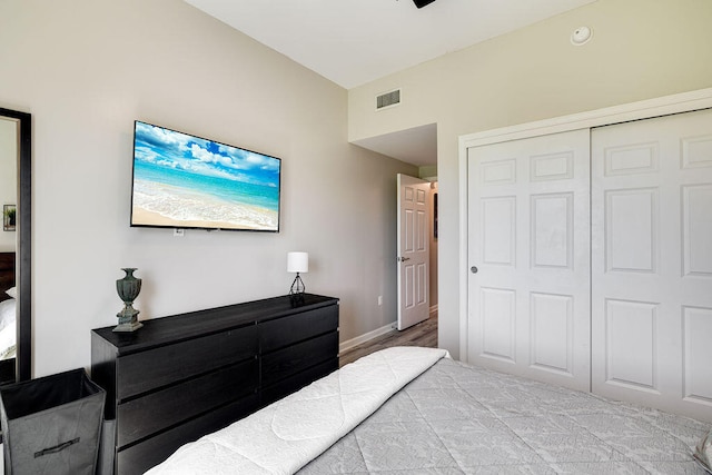 bedroom featuring a closet and light wood-type flooring